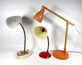 A contemporary desk lamp - orange shade and base with faux oak supports, together with two gooseneck