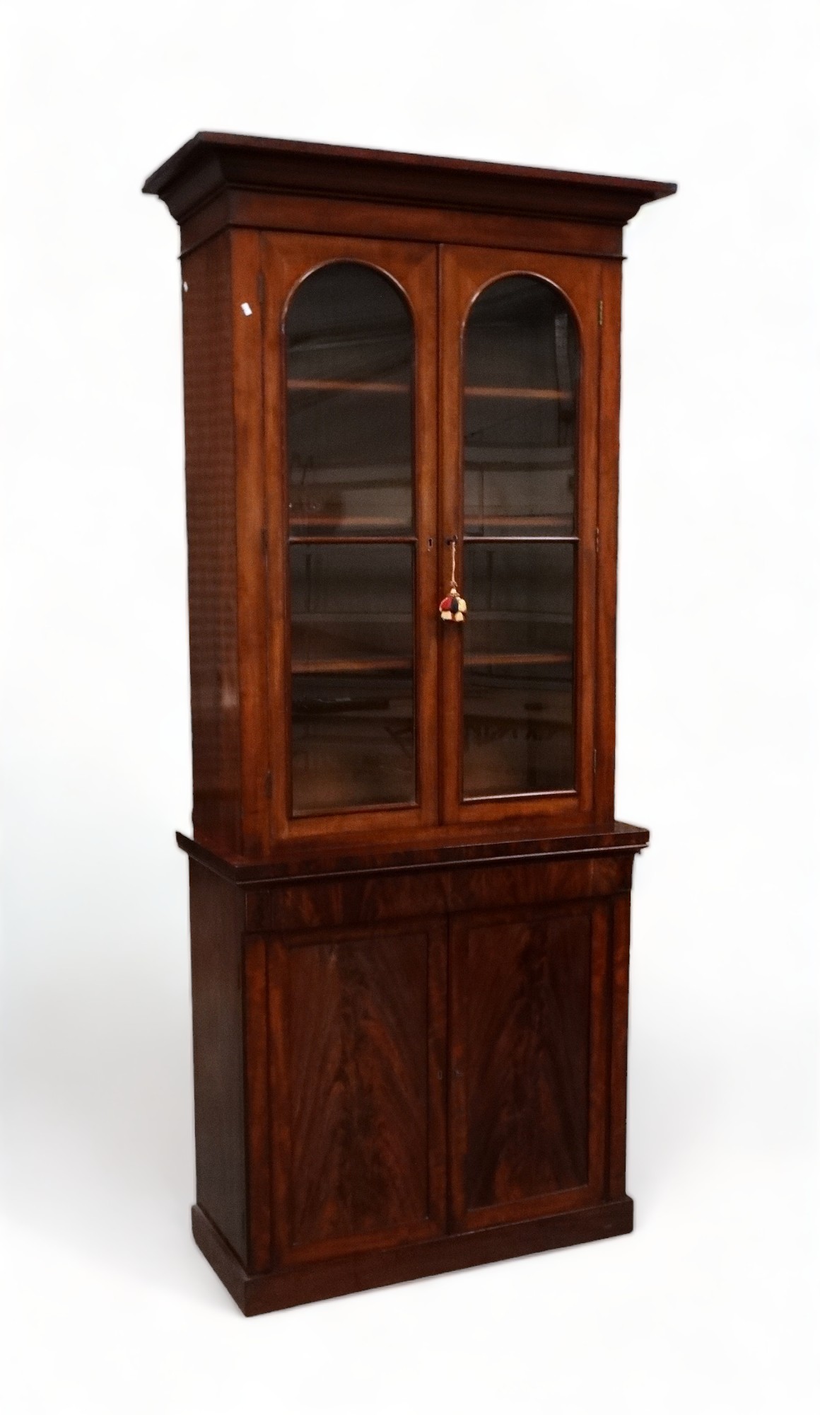 An early Victorian mahogany cabinet bookcase - the raised back with cornice above a pair of arched - Image 2 of 2