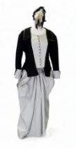 A re-enactment dress - in the form of a mid 19th century American woman, black with black and