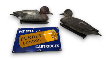 A pair of weighted decoy ducks - length 33cm.
