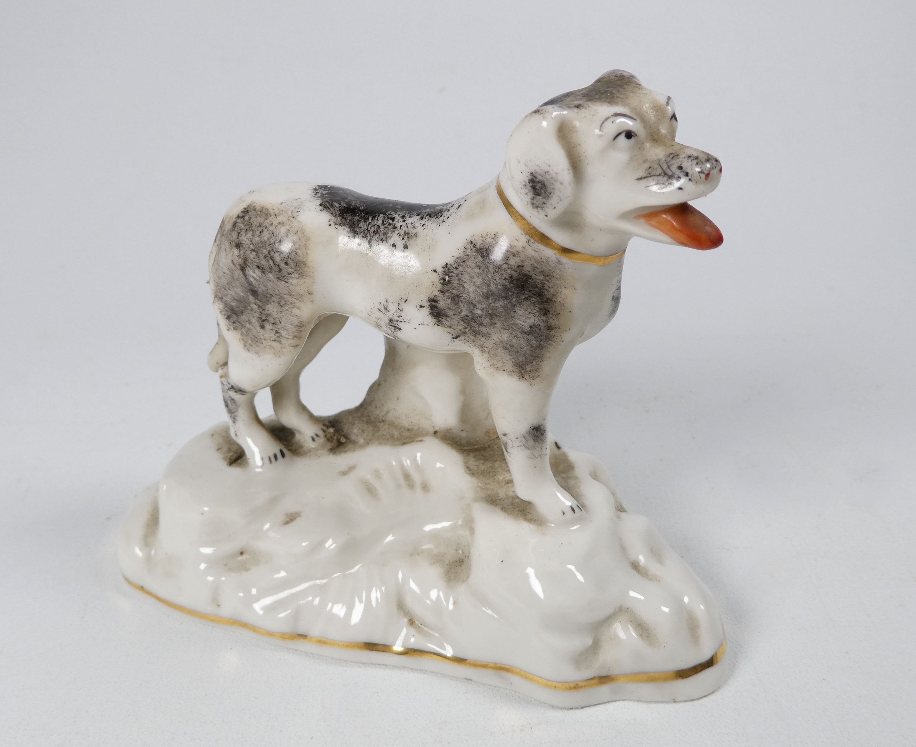 A pair of Chelsea style models of dogs - standing on a rocky base, sponge decorated, with a gilt - Image 2 of 7