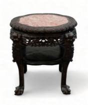 A late 19th century Chinese marble and hardwood circular jardiniere stand - the shaped top inset