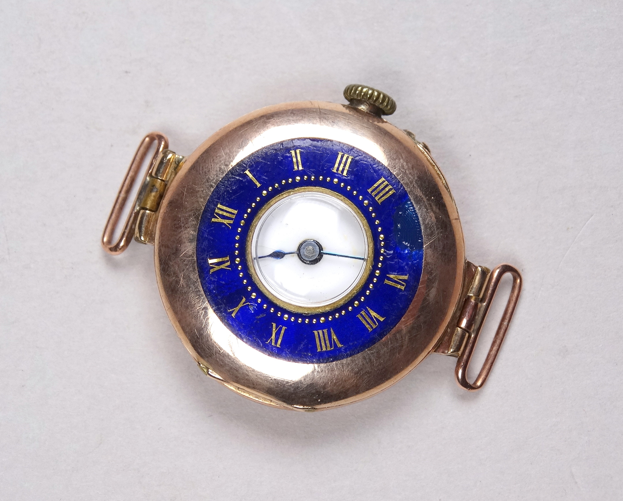 An early 20th century 9ct gold cased wristwatch - with a white enamel chapter ring set out in - Image 2 of 4