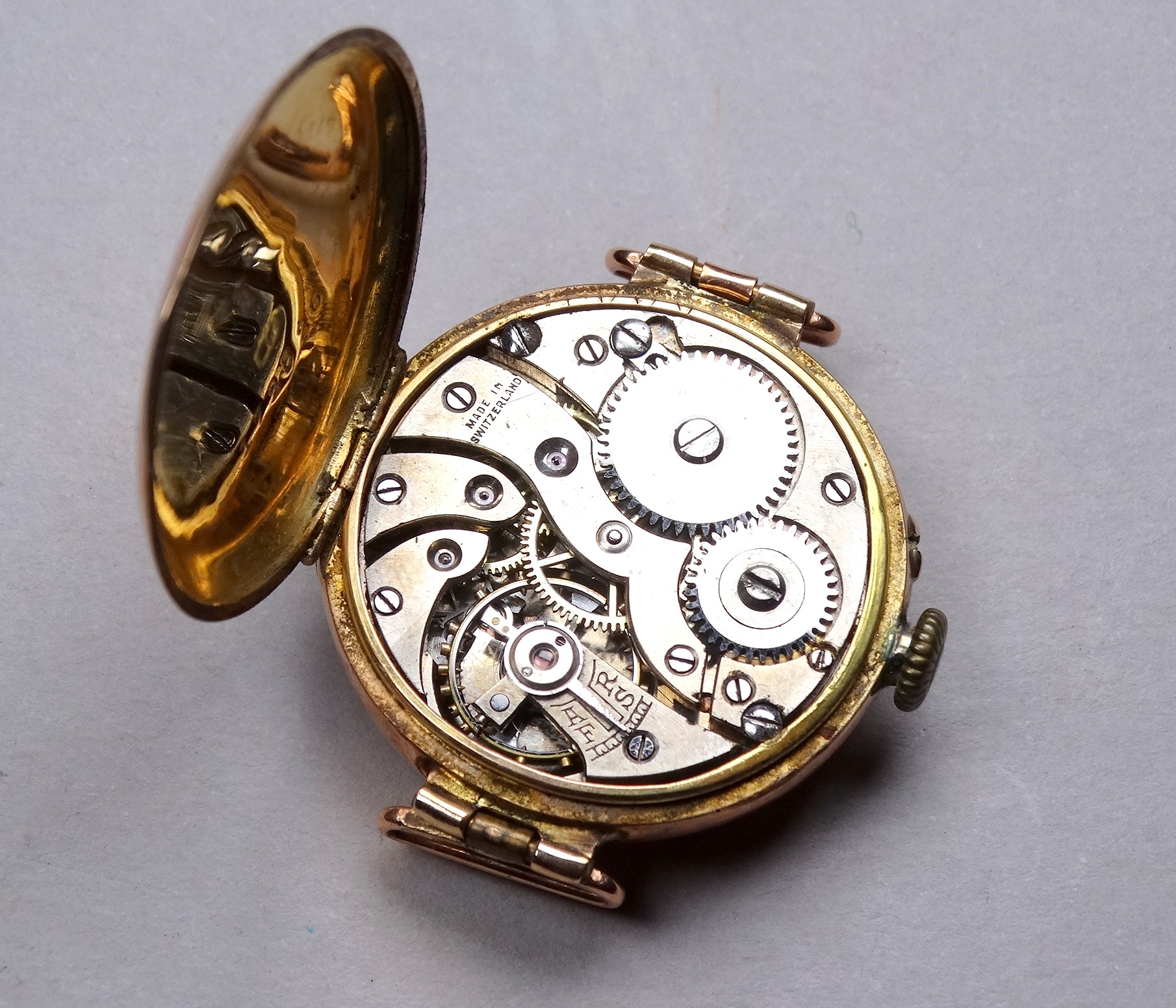 An early 20th century 9ct gold cased wristwatch - with a white enamel chapter ring set out in - Image 4 of 4