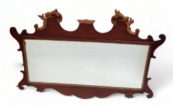 A George III style mahogany fretwork wall mirror - the broken cornice with gilt foliate decoration