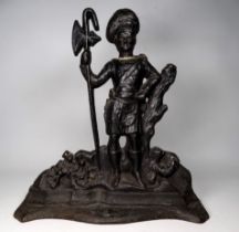 A black painted cast iron doorstop - modelled as a Scottish soldier, height 38cm.