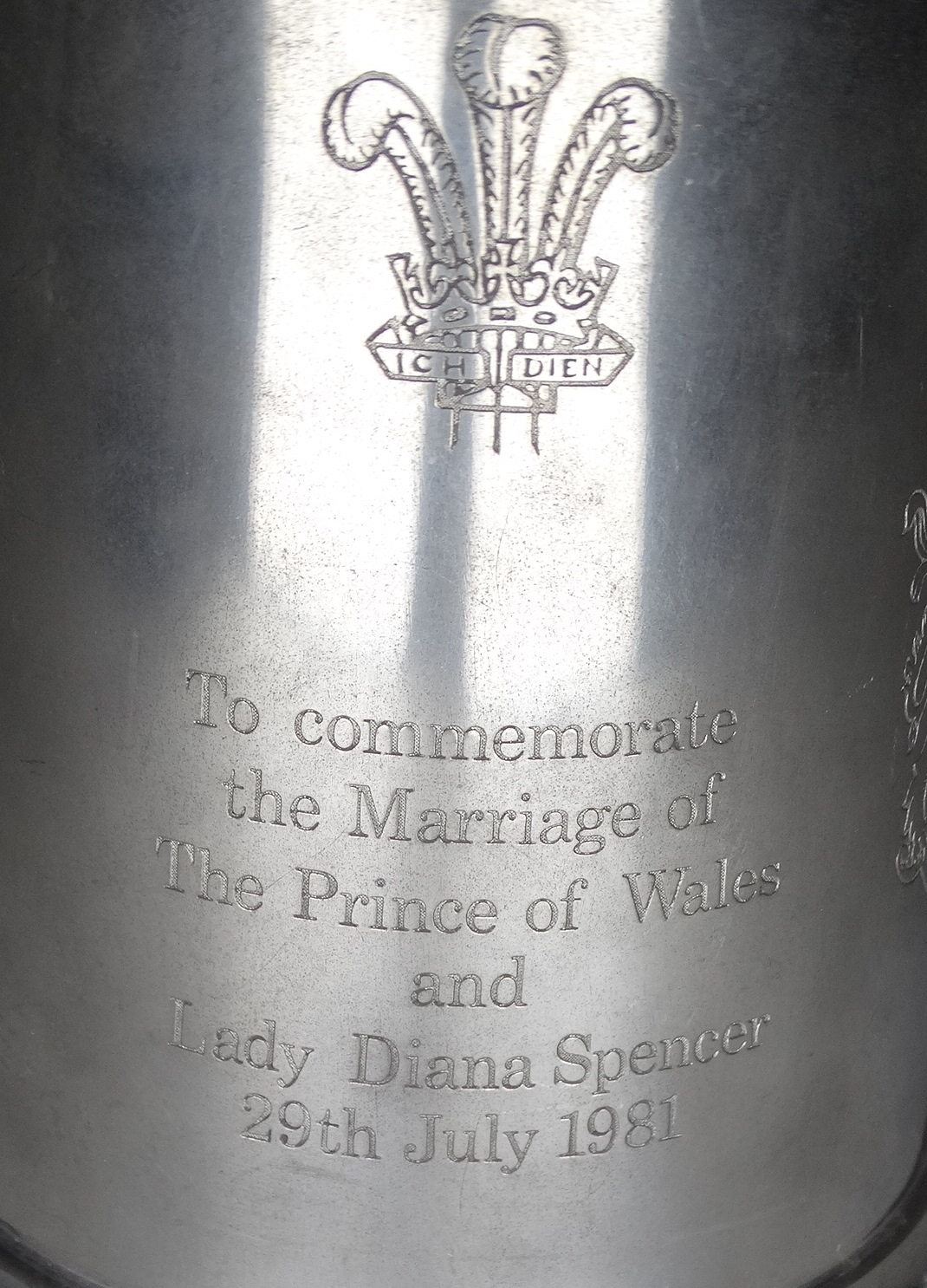 A pewter chamberstick - together with three pewter tankards and a steel tankard. (5) - Image 4 of 5