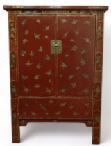 A 19th century Chinese lacquered cabinet - decorated with butterflies and cherry blossom, the pair