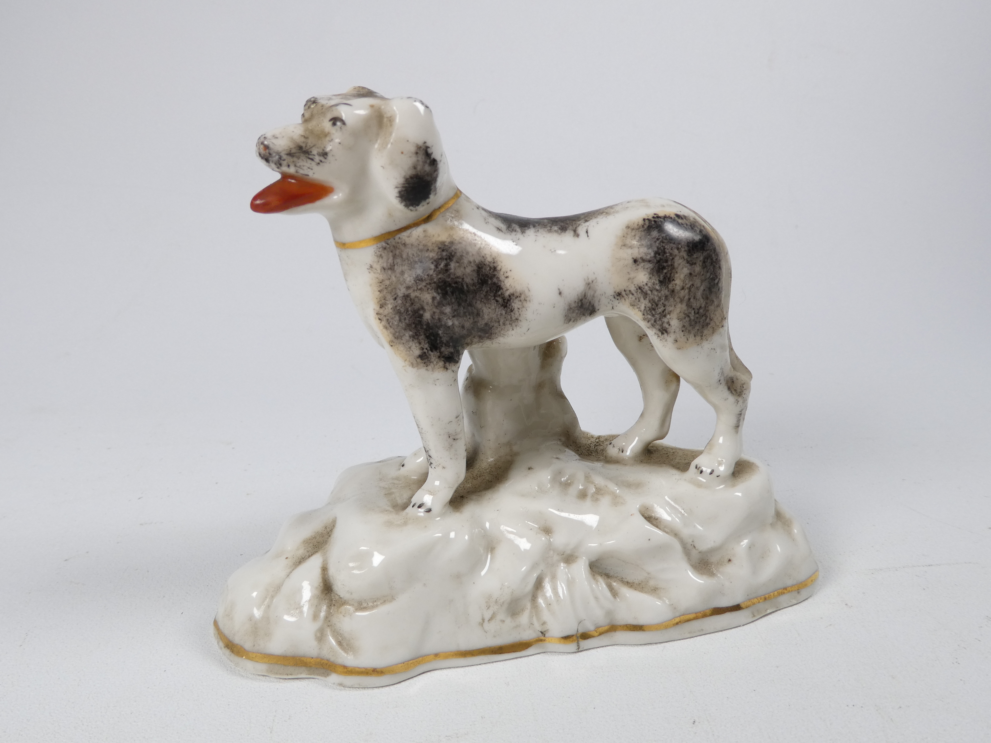 A pair of Chelsea style models of dogs - standing on a rocky base, sponge decorated, with a gilt - Image 5 of 7