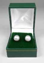 A pair of 9ct yellow gold ear studs - set with circular grey cultured pearls, weight 2.3g.