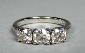 An 18ct white gold three stone diamond ring - the circular brilliant cut diamonds weighing 1.53ct