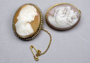 A 19th century cameo brooch - oval and carved with a figure and harp, set in a gilt frame stamped