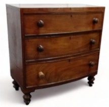 A 19th century mahogany bow front chest of drawers - with an arrangement of two short and two long