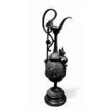 After the antique, a cast metal ewer - decorated with flowers and masks on a socle base, height