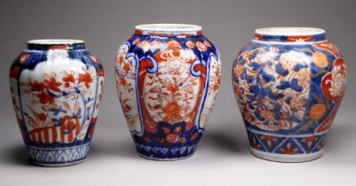 A Japanese Imari vase - of squat baluster form, decorated with panels of flowers, height 13cm,