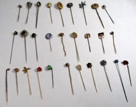 A quantity of 19th century and later gilt metal and enamel stock pins - some fitted with gemstones