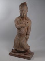 A Chinese terracotta figure of a scholar - height 44cm.