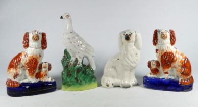 A pair of 19th century flatback figures - modelled as dogs, height 20cm, together with another and a