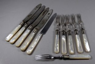 A late 19th century mother of pearl fruit service - the blades with engraved foliage.