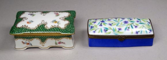 A Limoges stamp box - rectangular and decorated with floral sprigs with a green border, width 8cm,