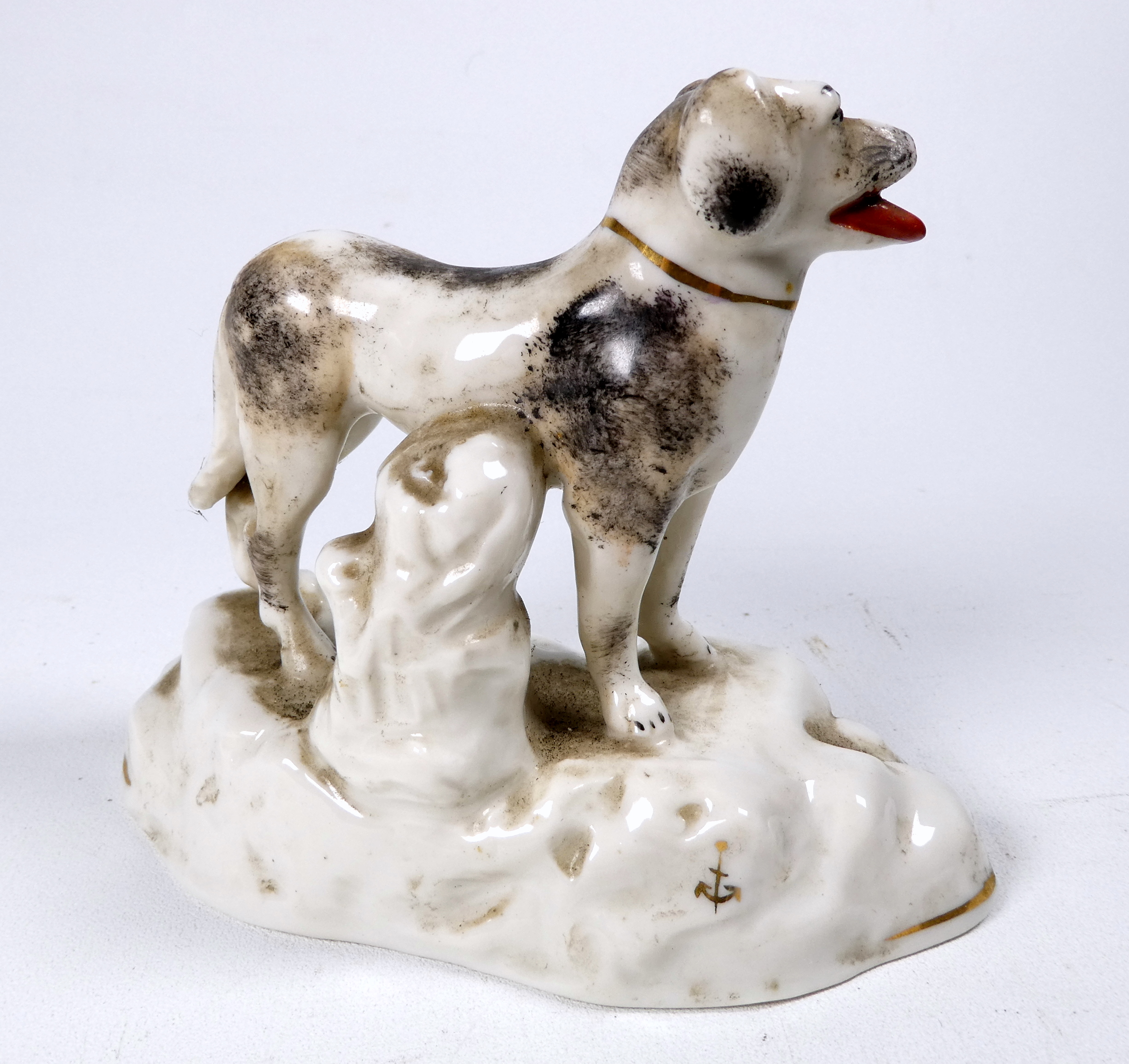 A pair of Chelsea style models of dogs - standing on a rocky base, sponge decorated, with a gilt - Image 6 of 7