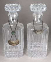 A pair of pressed glass decanters - with square stoppers and bodies and silver plated decanter