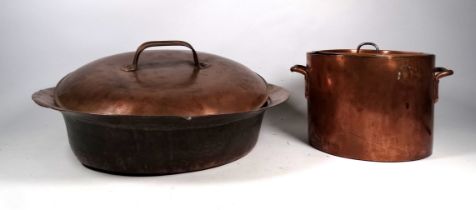 A late 19th century copper pan - with twin handles and lid, diameter 22cm, together with another