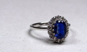 An 18ct white gold kyanite and diamond set cluster ring - the central oval kyanite weighing 1.77ct