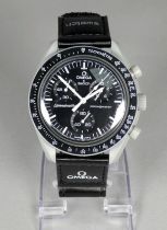 An Omega x Swatch Speedmaster - Misson to the Moon wristwatch, with original strap.