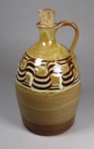 A Nonsuch Pottery jug - Alan Frewin (British b. 1935), with loop handle and waved design to neck,