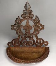 An early 20th century cast iron wall bracket - pierced with a semi circular dished base, height