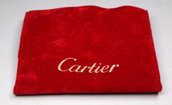 A red velvet jewellery pouch - marked Cartier.