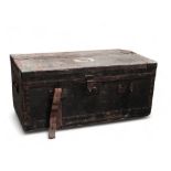 An early 20th century car trunk - covered in black oilcloth with steel banding and brass corners,