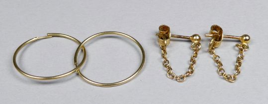 A pair of 9ct yellow gold earrings - weight 0.9g, together with a pair of yellow metal hoop