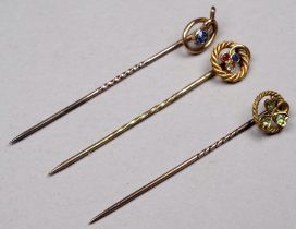 A 15ct gold stock pin - the rope twist setting with diamond, ruby and sapphire, together with two