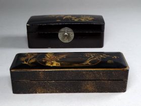 A late 19th century Japanese black lacquer stamp box - rectangular, the top gilt decorated with a