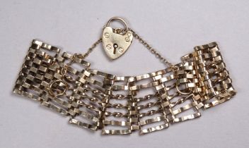 An early 20th century 9ct gold gatelink bracelet - with a heart shaped clasp, weight 27.7g.