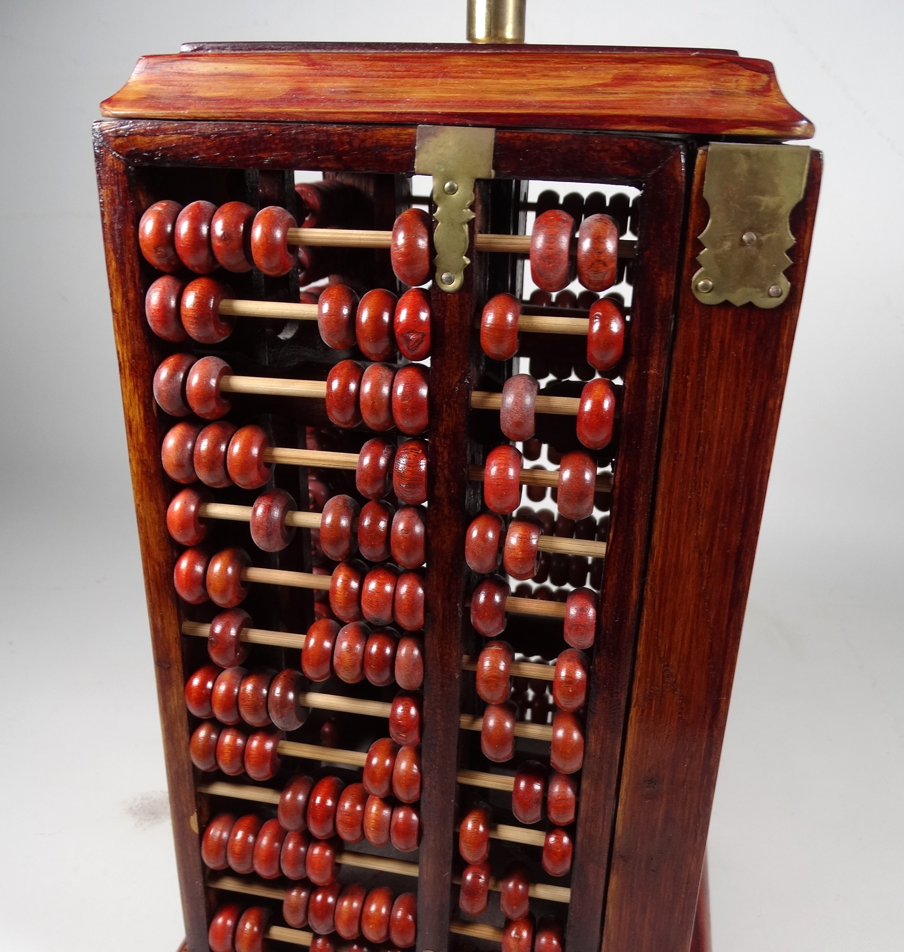 A 20th century oriental table lamp - of square form with abacus panels and a conical rafia shade, - Image 2 of 4