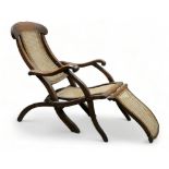 A late 19th century walnut 'steamer' deck chair - with an X-frame folding action, the back, seat and