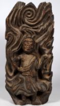 A carved Indonesian hardwood figure of a deity - height 28cm.