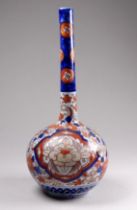 A Japanese Imari bottle vase - the bulbous body with a long narrow neck, height 21cm.