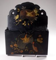 A 19th century papier mache letter rack - gilt decorated with birds and a carp, width 17cm.