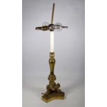 A brass Italian style table lamp - of baluster form, with tripod base and with claw feet, height