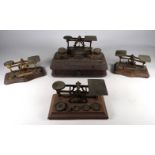 An early 20th century mahogany standish - incorporating a pair of glass inkwells, a drawer and a set