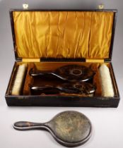 An Edwardian five piece silver and tortoiseshell brush set - London 1926, William Comyns & Sons Ltd,