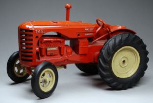 A Lesney Massey-Harris 745D Tractor - red/orange body, beige wheels and black rubber tyres.