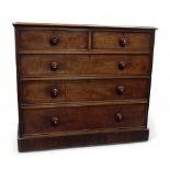 A Victorian mahogany chest of drawers - the rectangular moulded top above an arrangement of two