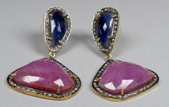 A pair of drop earrings in silver and gold set with sapphires, rubies and diamonds - the sapphires
