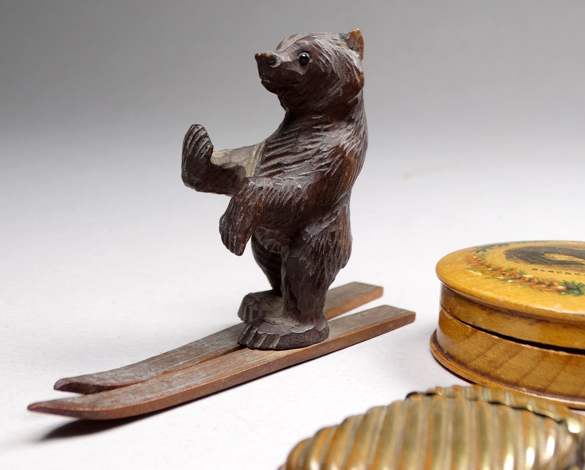 An early 20th century Black Forest bear - standing on skis, height 6cm, together with another, two - Image 4 of 6