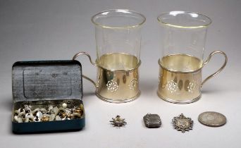 A pair of silver mounted tea glasses - Birmingham 1932, the frames pierced with disks, together with